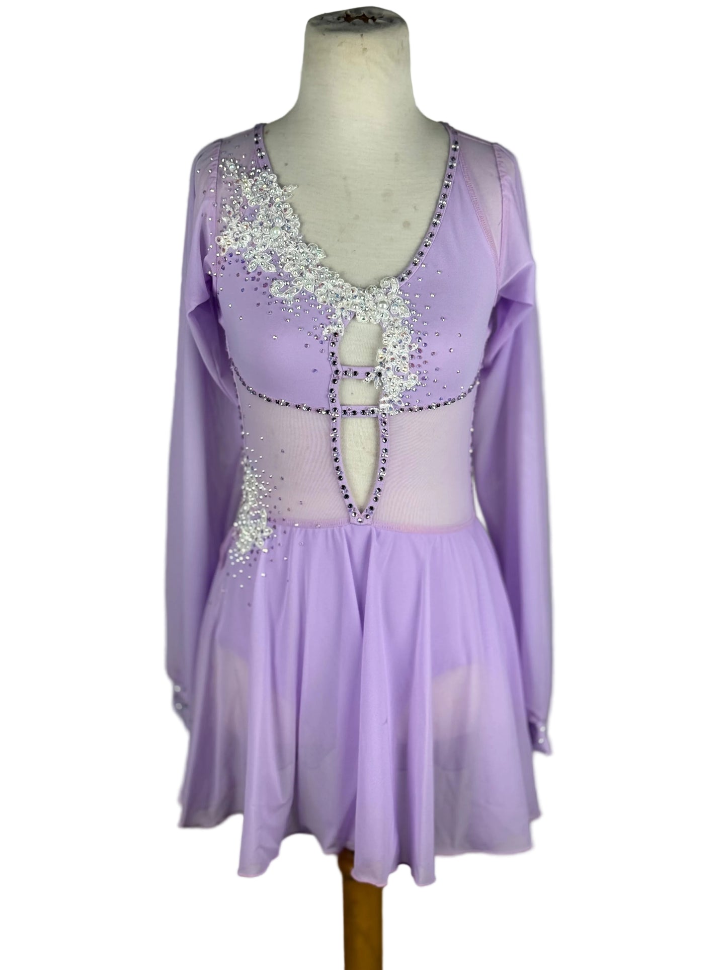 Lavender dance costume with sequined top on a mannequin against a white background