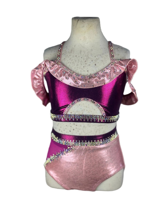 Pink and purple two-piece with ruffled top on a mannequin against a white background
