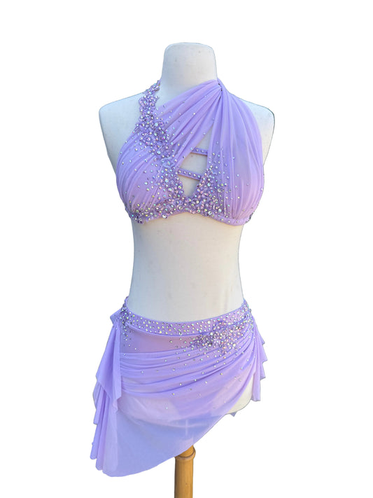 Lavender dance costume with beading on a mannequin against a white background.