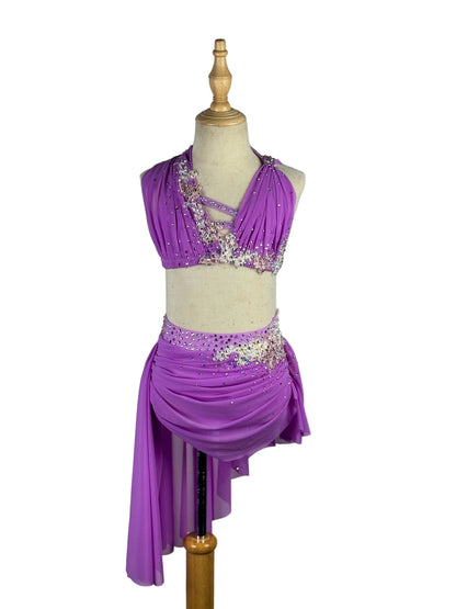 Purple dance costume with embellishments on a mannequin against a white background