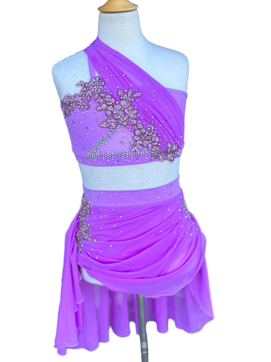 Purple and light blue dress with embellishments on a mannequin against a white background