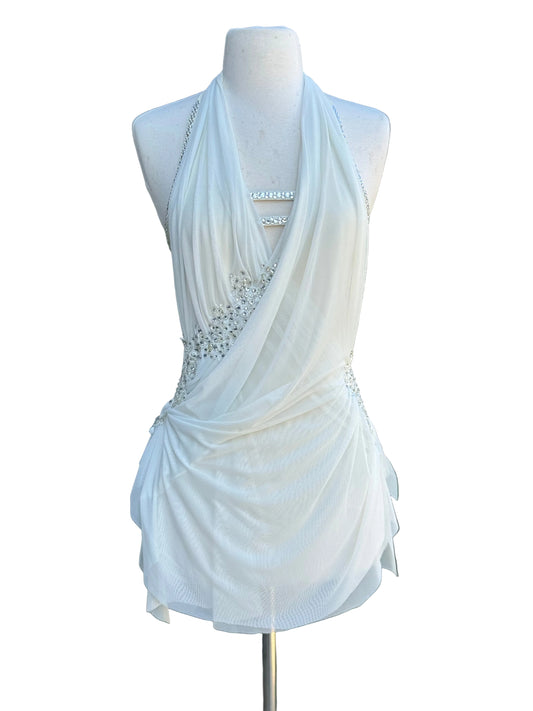 An ivory lyrical dance dress with embellishments against a white background.