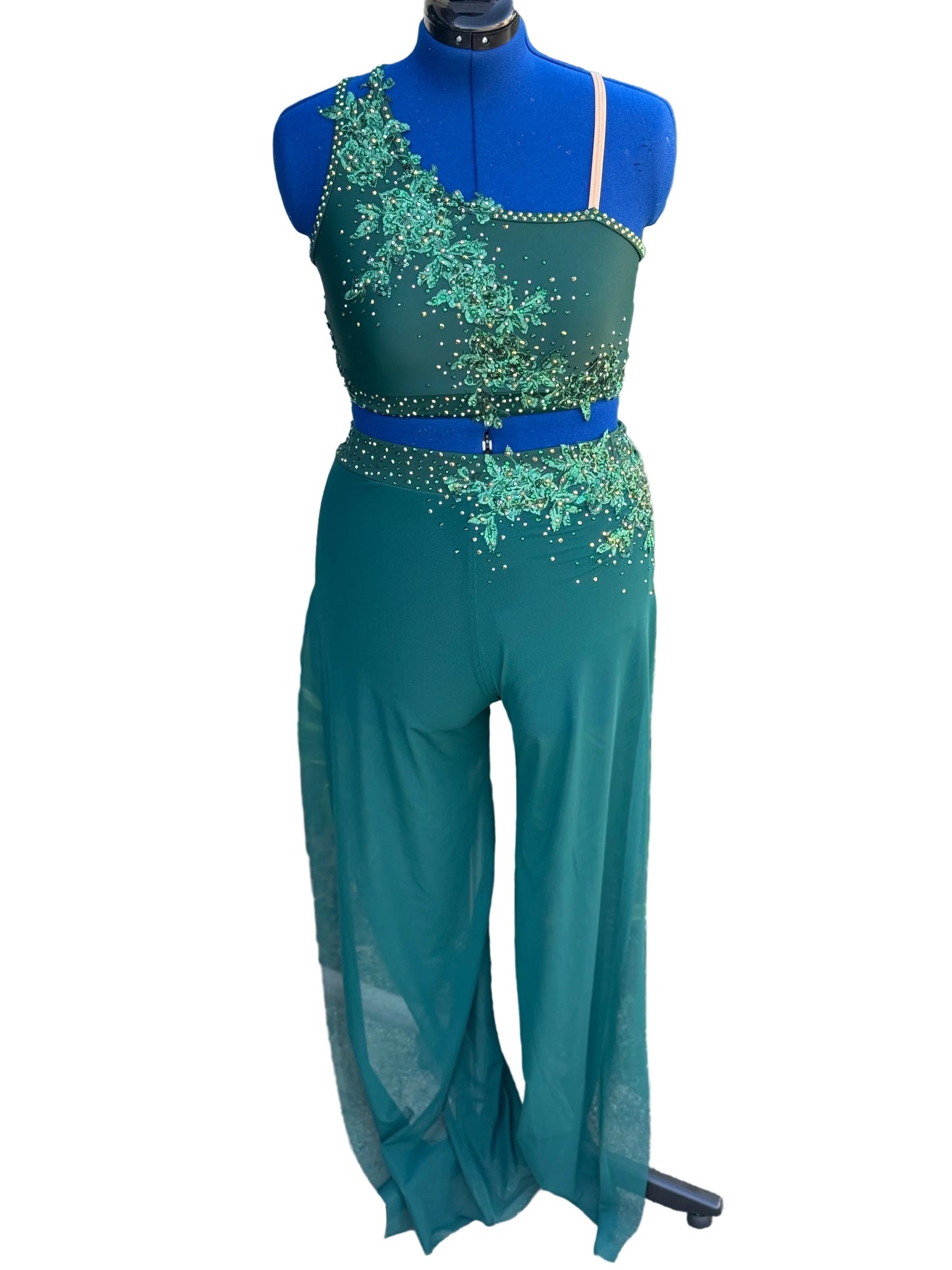 Green dance costume on a mannequin against a white background