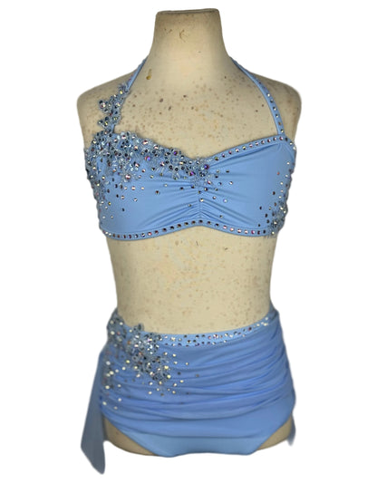 Blue dance costume with embellishments on a mannequin against a plain background