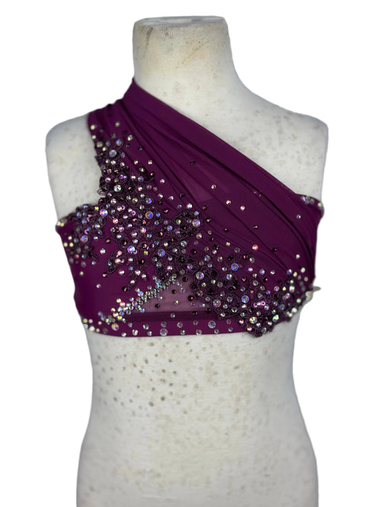 Purple one-shoulder top with sequins on a mannequin against a white background