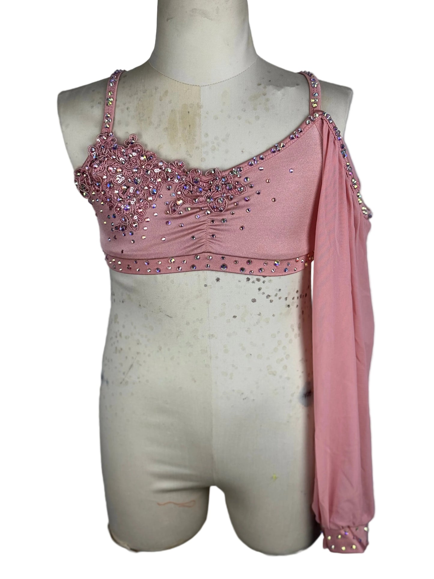 Pink one sleeve top on a mannequin against a white background