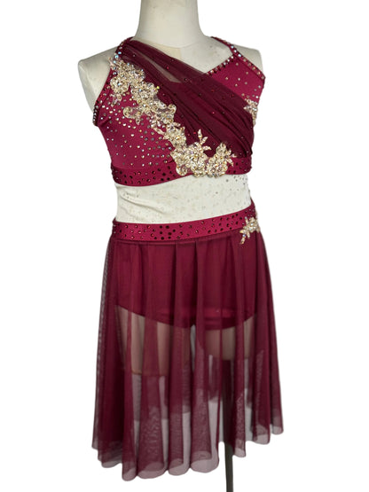 Maroon and white dress with gold embellishments on a mannequin against a plain background