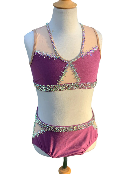 Leotard with purple design and embellishments on a mannequin against a white background.